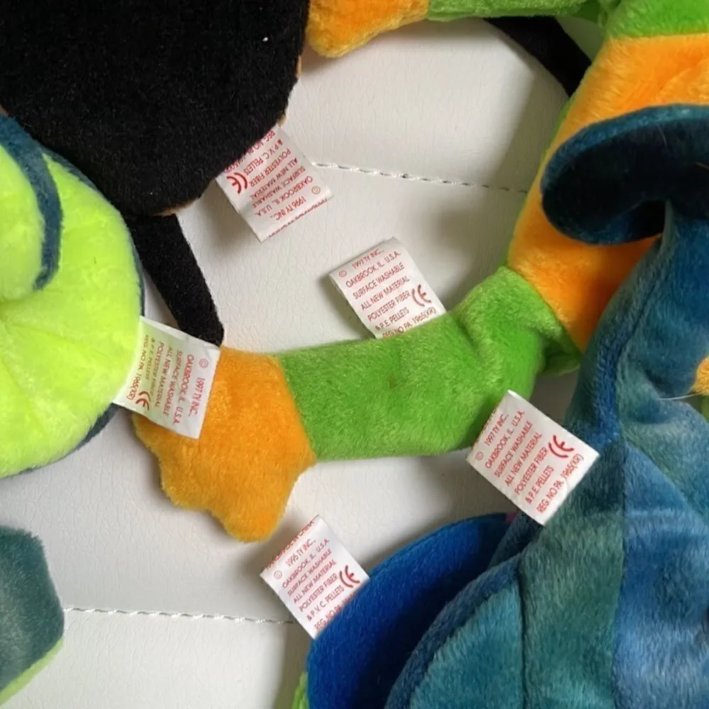 5 beanie babies.  Hissy, Spinner, Smoochy, Inch, Rainbow.